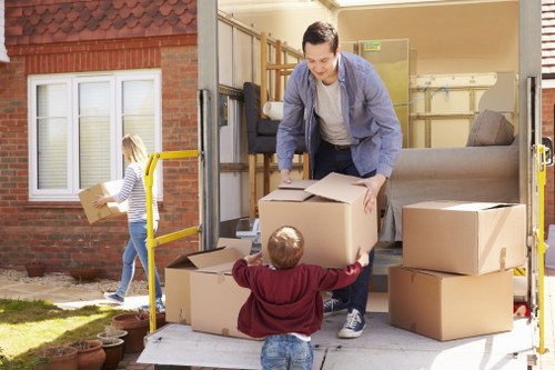 Removal van loading boxes outside a Cotland home