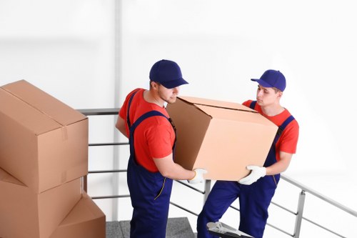 Professional movers preparing belongings for a safe relocation in Cotland
