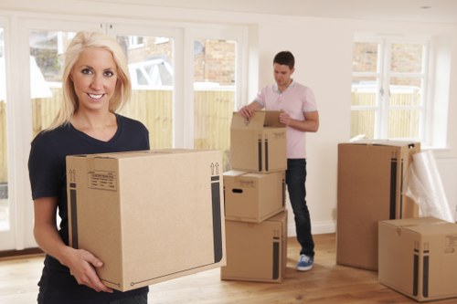 Team protecting floors and walls during a property move