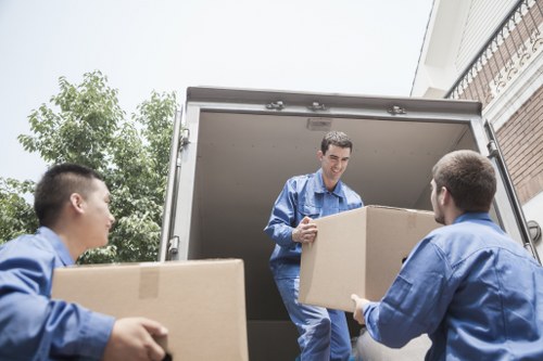 Man with a van loading furniture for a local move in Cotland