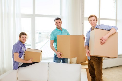 Local moving team loading furniture into a van in Cotland