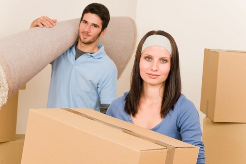 Movers navigating a residential street with parking considerations in Cotland