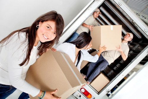 Furniture and boxes being organised for transport by Cotland movers